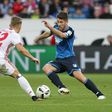 Hoffenheim's forward Sandro Wagner and Hamburg's defender Matthias Ostrzolek (L) fight for the ball during the Bundesliga football match in Sinsheim on November 20, 2016