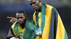Jamaica's Nesta Carter (L), who tested positive for a banned substance, and Usain Bolt (R) were teammates in the men's 4×100m relay final during the 2008 Beijing Olympic Games, where they won gold