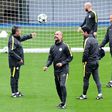 Manchester City's manager Pep Guardiola (C) controls the ball during a team training session at Manchester City Football Academy Campus in Manchester, on September 27, 2016