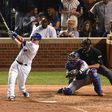 Miguel Montero of the Chicago Cubs hits a grand slam home run in the eighth inning against the Los Angeles Dodgers during game one of the National League Championship Series, at Wrigley Field in Chicago, Illinois, on October 15, 2016