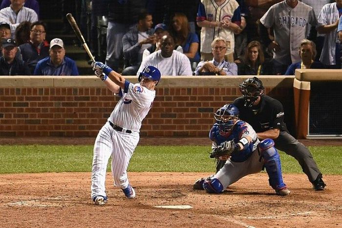 Miguel Montero of the Chicago Cubs hits a grand slam home run in the eighth inning against the Los Angeles Dodgers during game one of the National League Championship Series, at Wrigley Field in Chicago, Illinois, on October 15, 2016