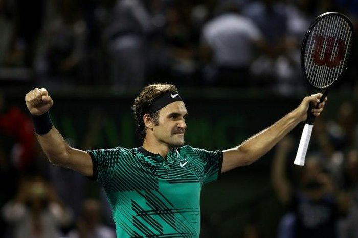 Roger Federer of Switzerland celebrates defeating Nick Kyrgios of Australia in the semi-finals at the Miami Open
