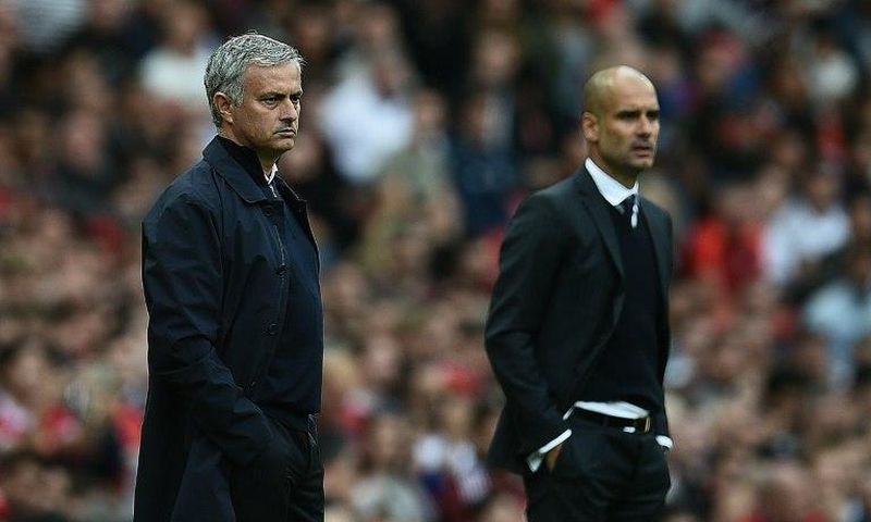 Manchester United's Jose Mourinho (left) and Manchester City's Pep Guardiola during the Premier League match between the two sides at Old Trafford on September 10, 2016