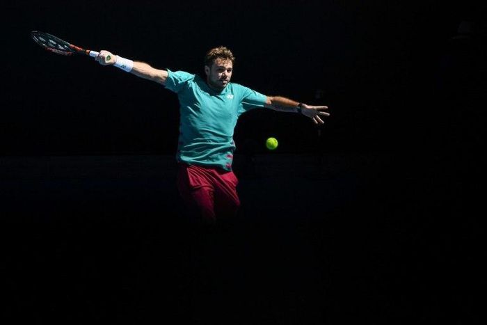 Switzerland's Stanislas Wawrinka hits a return against France's Jo-Wilfried Tsonga during their Australian Open quarter-final match, in Melbourne, on January 24, 2017