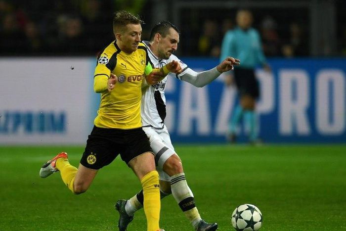Marco Reus (left) is netted a hat-trick in Borussia Dortmund's record 8-4 hammering of Legia Warsaw