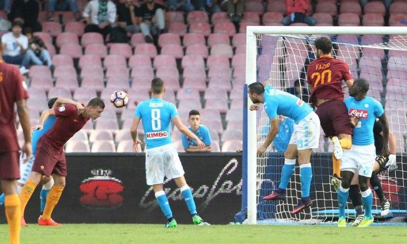 Edin Dzeko (left) scores for Roma against Napoli on October 15, 2016 at the San Paolo stadium in Naples