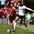 Bournemouth's English midfielder Dan Gosling (L) grapples with Tottenham's English midfielder Dele Alli during the Premier League match at the Vitality Stadium in Bournemouth, southern England on October 22, 2016