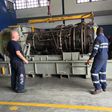 Field service engineers assess the gas turbine in Port Harcourt, Nigeria.