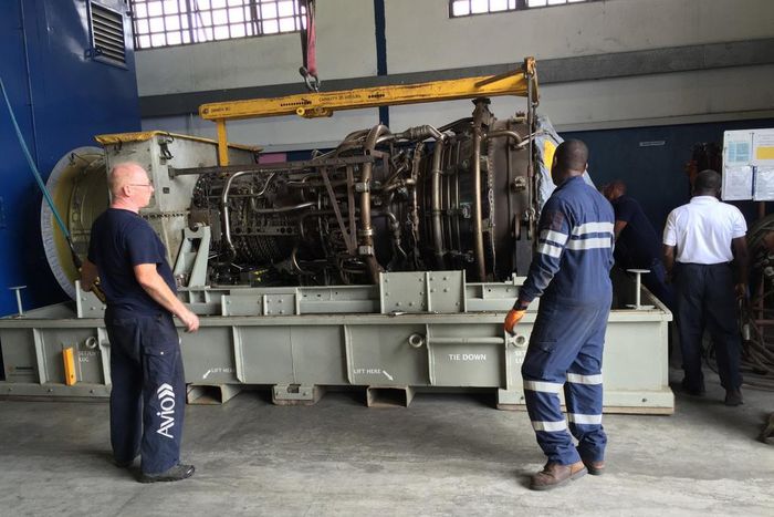 Field service engineers assess the gas turbine in Port Harcourt, Nigeria.
