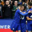 Leicester City's Jamie Vardy (L) is congratulated by teammate Christian Fuchs after scoring a goal during their English Premier League match against Stoke City, at King Power Stadium in Leicester, on April 1, 2017