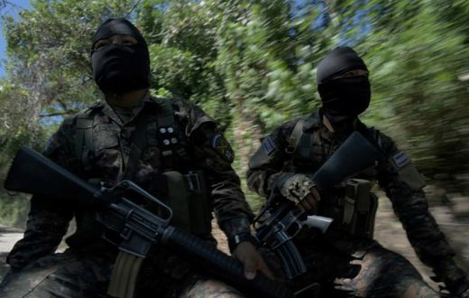 Soldiers patrol in search of gang members around the municipalities of San Martin and San Jose Guayabal, in El Salvador
