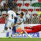 Uruguay's goalkeeper Fernando Muslera (R) jumps to save the ball as Uruguay's defender Jose Maria Gimenez (not pictured) scores an own goal during the friendly football match Italy vs Uruguay, a fumble that helped Italy achieve victory