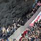 Thick black smoke forces a five-minute interruption of play during the crunch PSV Eindhoven tie with Ajax at the Philips Stadion