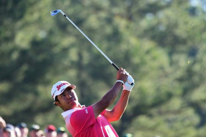 Hideki Matsuyama of Japan plays his shot from the 12th tee at Augusta National Golf Club on April 4, 2017