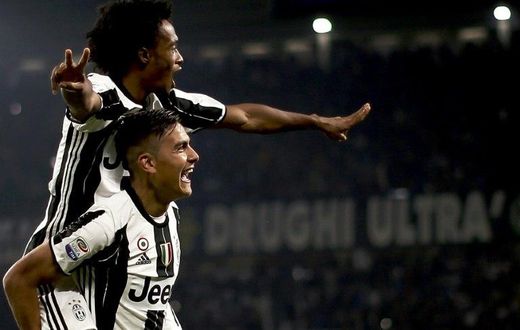 Juventus' forward Paulo Dybala (down) has been tipped for success by rival Diego Perotti