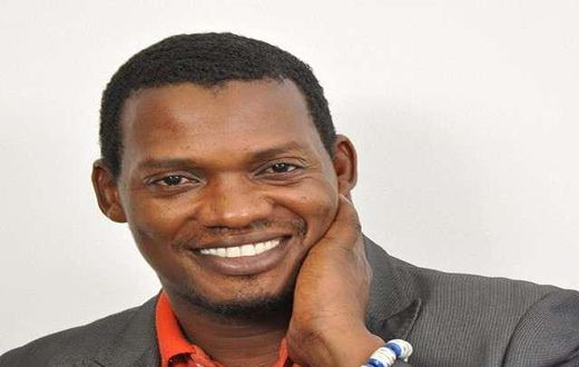 Kwesi Ennin of media Excel in suit