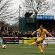 Sutton United defender Jamie Collins scores the opening goal from the penalty spot during the English FA Cup match between Sutton United and Leeds United at the Borough Sports Ground in London on January 29, 2017