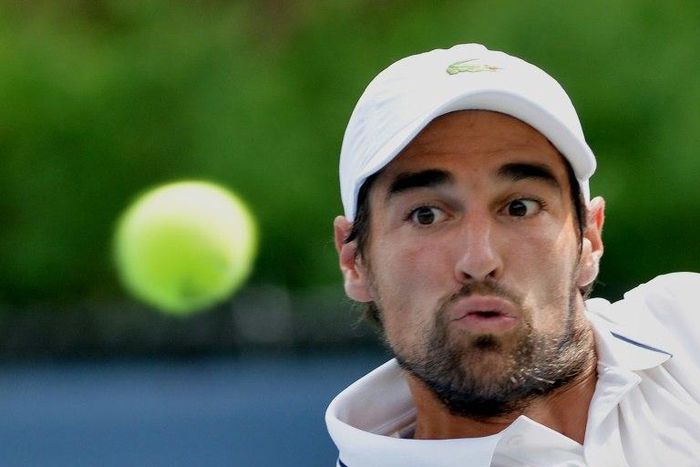 Jeremy Chardy eyes the ball at the USTA Billie Jean King National Tennis Center on August 30, 2013, in New York
