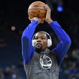 Kevin Durant of the Golden State Warriors warms up prior to the start of their game against the New Orleans Pelicans, at ORACLE Arena in Oakland, California, on April 8, 2017