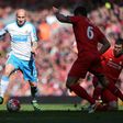 Newcastle United's midfielder Jonjo Shelvey (L) runs with the ball during the English Premier League football match between Liverpool and Newcastle United