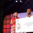 Moses Ugheighele still receives his prize from Rosy Fynn, Marketing Director, Airtel Ghana.