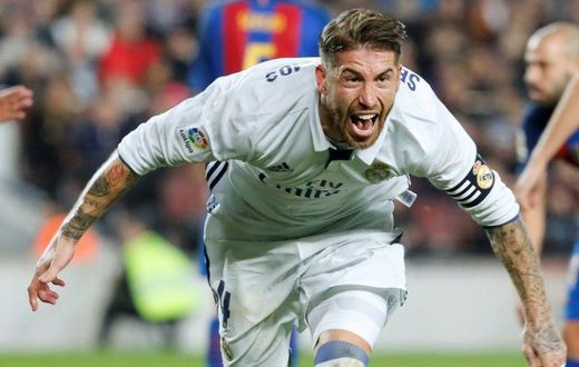 Real Madrid's defender Sergio Ramos celebrates after scoring a goal during the Spanish league football match FC Barcelona vs Real Madrid CF at the Camp Nou stadium in Barcelona on December 3, 2016