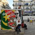 Algerians play football in Algiers' Bab el-Oued neighbourhood, which is historically known to be a predominantly pro-Mouloudia Club Alger (MCA) area