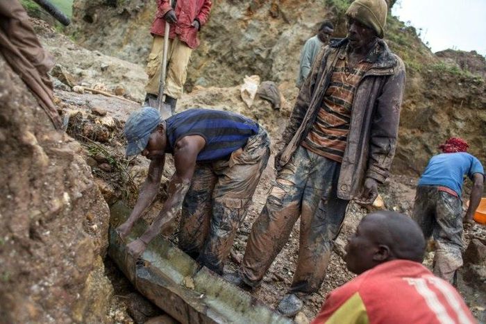 Sorting and washing rocks at a cassiterite mining site near Numbi in eastern Democratic Republic of Congo.