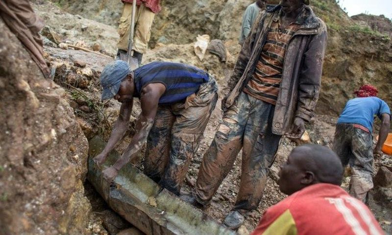 Sorting and washing rocks at a cassiterite mining site near Numbi in eastern Democratic Republic of Congo.