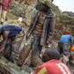 Sorting and washing rocks at a cassiterite mining site near Numbi in eastern Democratic Republic of Congo.