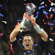 Tom Brady of the New England Patriots holds the Vince Lombardi Trophy aloft after their 34-28 overtime victory over Atlanta Falcons in Super Bowl 51 at NRG Stadium in Houston, Texas on February 5, 2017