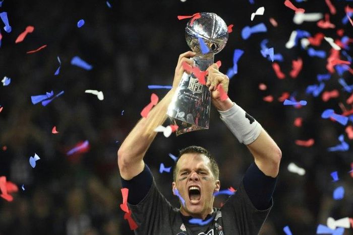 Tom Brady of the New England Patriots holds the Vince Lombardi Trophy aloft after their 34-28 overtime victory over Atlanta Falcons in Super Bowl 51 at NRG Stadium in Houston, Texas on February 5, 2017
