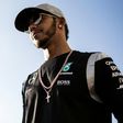 Mercedes driver Lewis Hamilton of Britain looks on after talking to the media during the Formula One Japanese Grand Prix in Suzuka on October 6, 2016