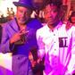 Fancy Gadam shows off his award with Reggie Rockstone