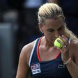 Dominika Cibulkova of Slovakia smells a ball as she plays against to Lesia Tsurenko of Ukraine during their 2016 US Open Women's Singles match at the USTA Billie Jean King National Tennis Center in New York on September 2, 2016