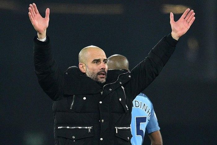 Manchester City's manager Pep Guardiola celebrates on the pitch after the English Premier League football match between Bournemouth and Manchester City at the Vitality Stadium in Bournemouth, southern England on February 13, 2017