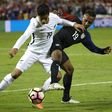 Julian Green (R) of the US fights for the ball with Moses Dyer of New Zealand during their int'l friendly at RFK Stadium in Washington, DC, on October 11, 2016