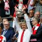 Arsenal's French manager Arsene Wenger lifts the FA Cup trophy after their win over Chelsea in the English FA Cup final football match between Arsenal and Chelsea at Wembley stadium in London on May 27, 2017
