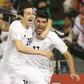 Iran's Mehdi Taremi (R) celebrates with teammate Sardar Azmoun (L) after scoring a goal against Qatar during their World Cup 2018 Asia qualifying football match in Doha on March 23, 2017