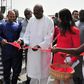 President of Burkina Faso Roch Marc Christian Kabore (C) cuts the ribbon during the inauguration of a new movie theatre which runs on solar power in Ouagadougou on February 24, 2017