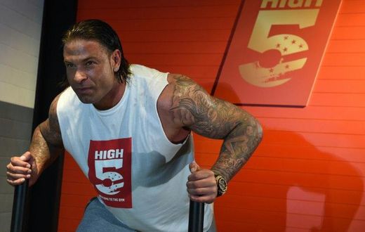 Former Germany goalkeeper Tim Wiese poses for photographers during the opening of a fitness studio in Berlin on March 26, 2015