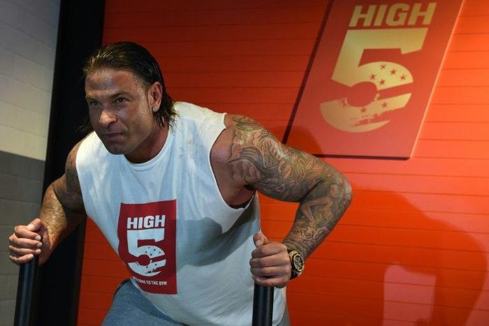 Former Germany goalkeeper Tim Wiese poses for photographers during the opening of a fitness studio in Berlin on March 26, 2015