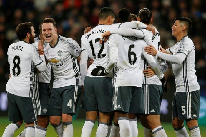 Manchester United players celebrate after scoring a goal during their English Premier League match against West Ham, in London, on January 2, 2017