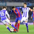 Barcelona's forward Neymar da Silva Santos Junior (C) vies with Real Sociedad's defender Aritz Elustondo (L) and midfielder Xabier Prieto (R) during the Spanish Copa del Rey quarter final first leg football match January 19, 2017
