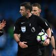 Manchester City's manager Pep Guardiola (L) speaks with referee Michael Oliver after the English Premier League football match between Manchester City and Liverpool on March 19, 2017