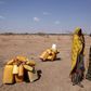 Woman wait to collect water in the drought stricken Somali region in Ethiopia, January 26, 2016. REUTERS/Tiksa Negeri