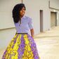 African woman rocking midi skirt and shirt