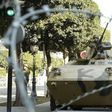 An army soldier stands guard behind a wire fence cordon outside the interior minister's office in Tunis February 7, 2011. REUTERS/Zoubier Souissi
