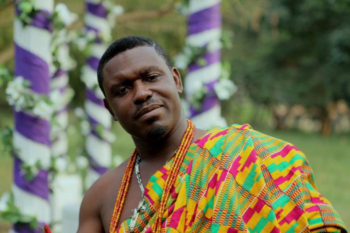 Nacee in a Kente cloth