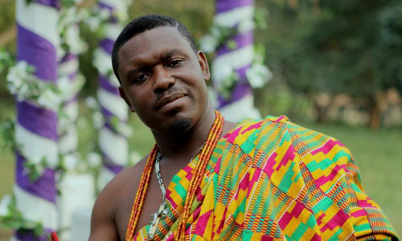 Nacee in a Kente cloth